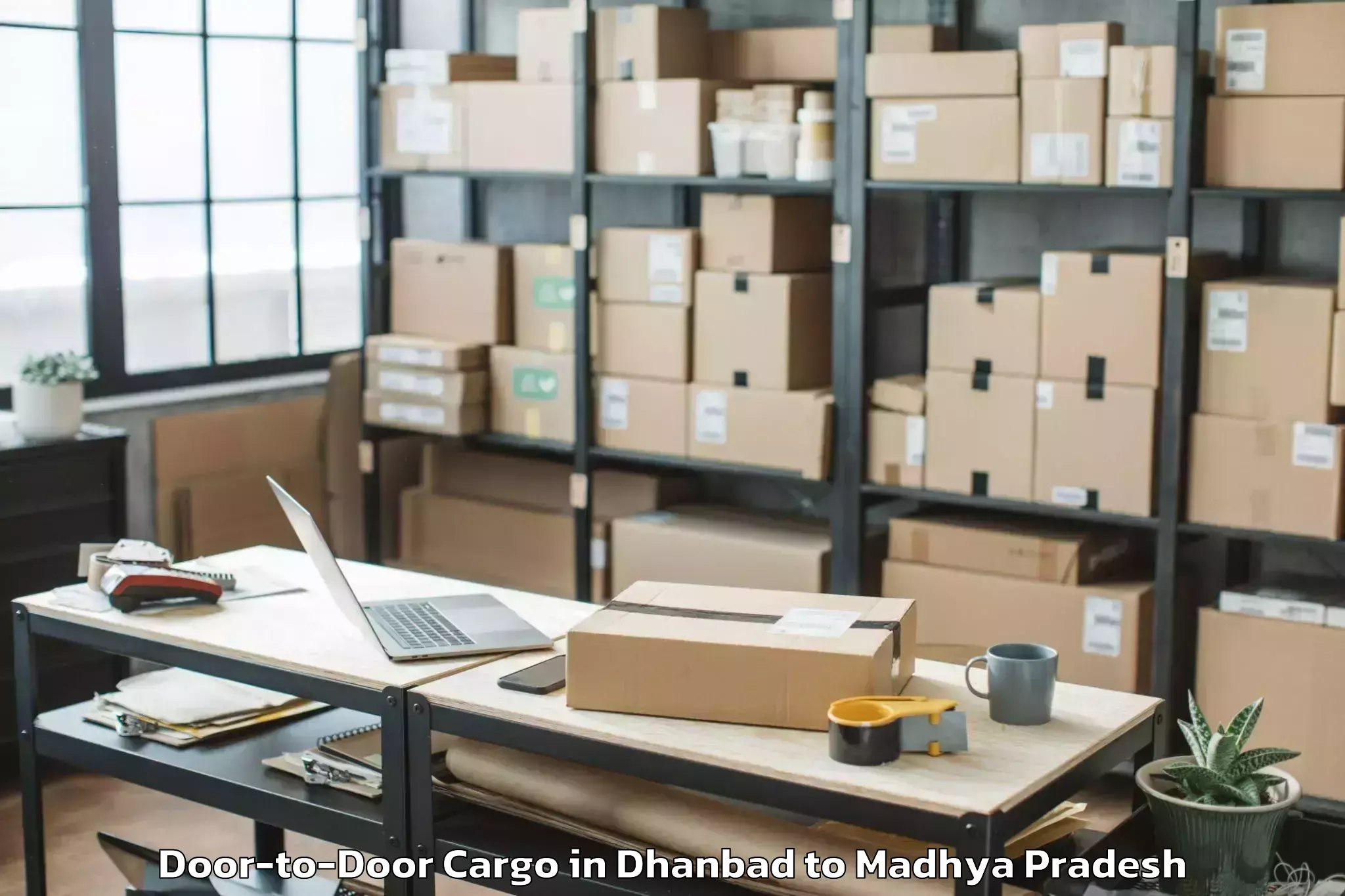 Book Dhanbad to Malwanchal University Indore Door To Door Cargo Online